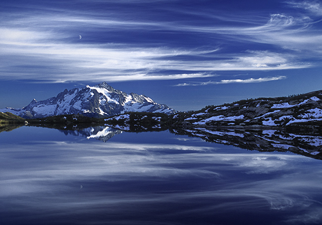 Mt. Shuksan with clouds, moon and tarn